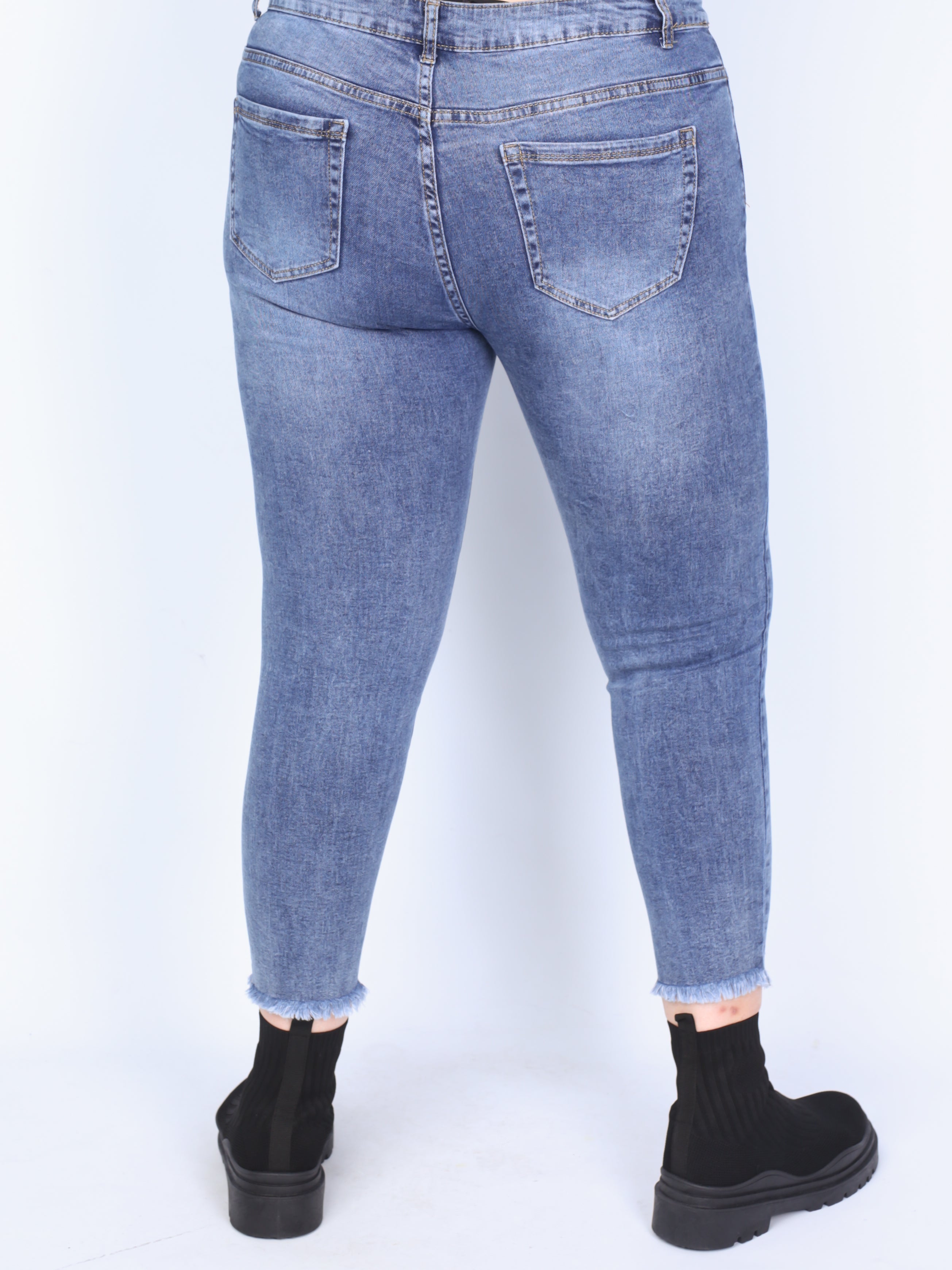Plus size jeans with holes and wear