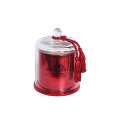 Scented candle in red glass