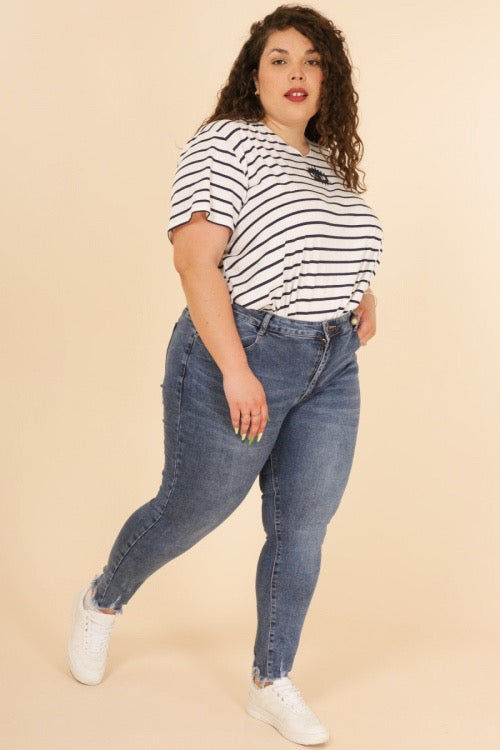 Plus size jeans with fringe detail at the bottom