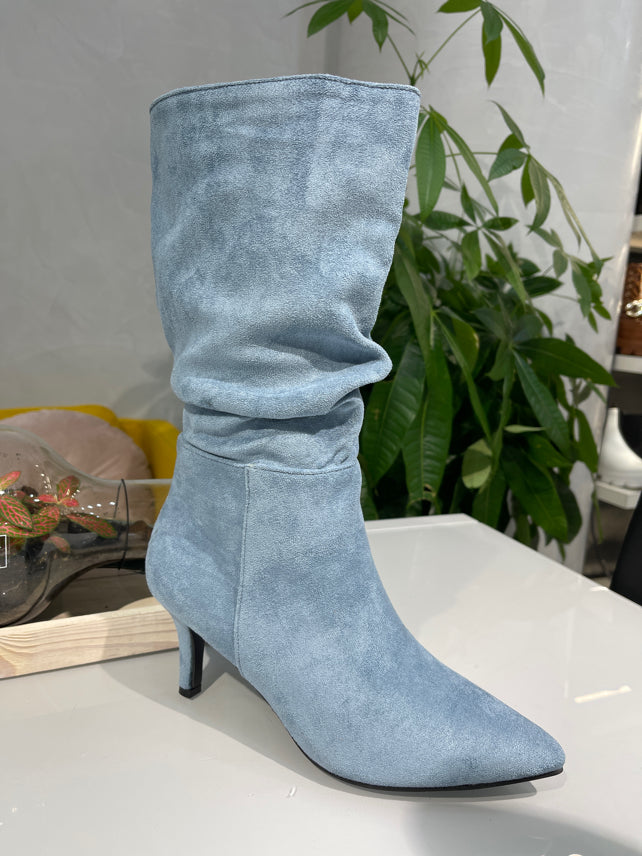 Pointed boots with a small heel