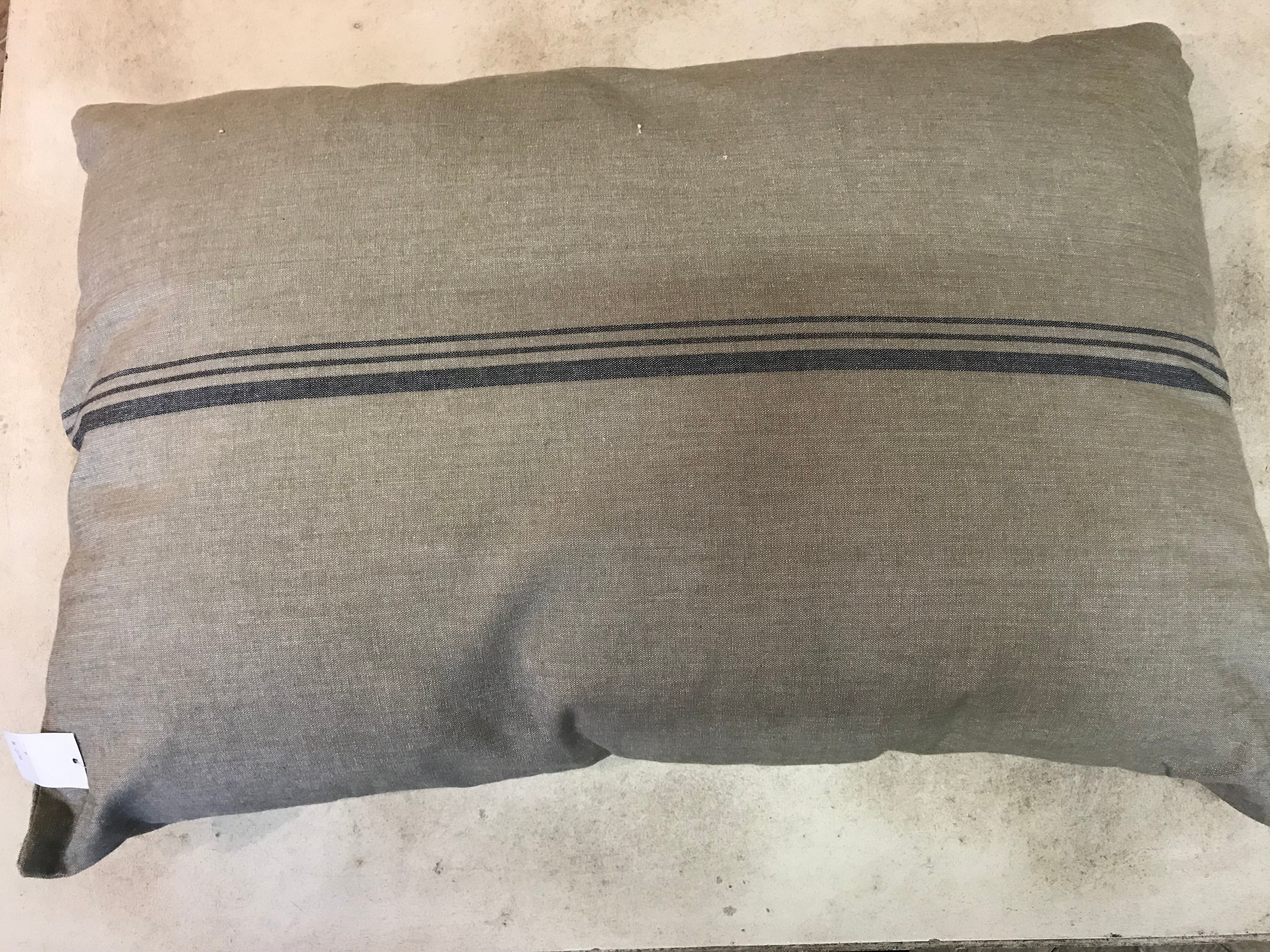 Pillow, sand-colored with blue stripe and bows